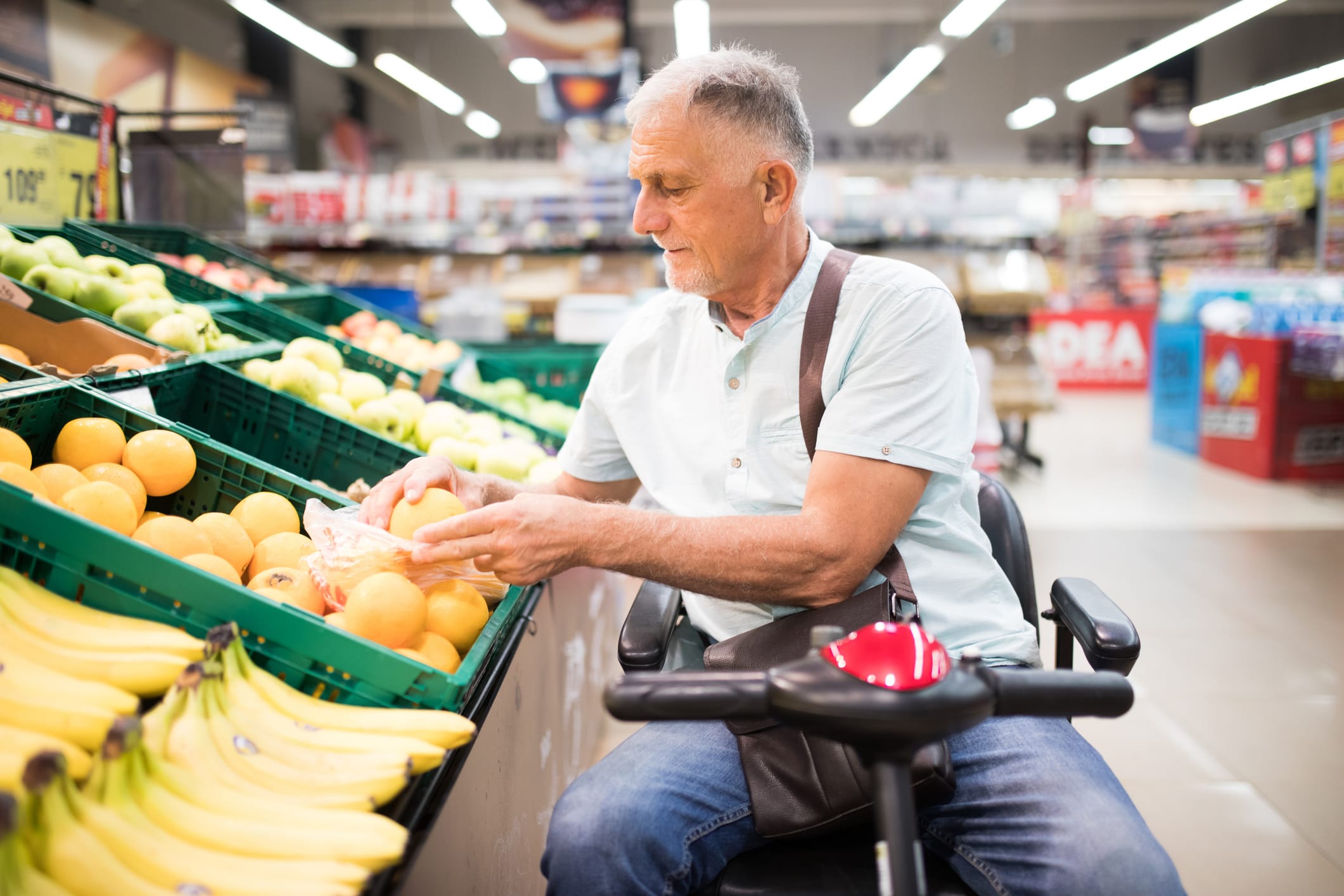 Man using a mobility scooter while shopping