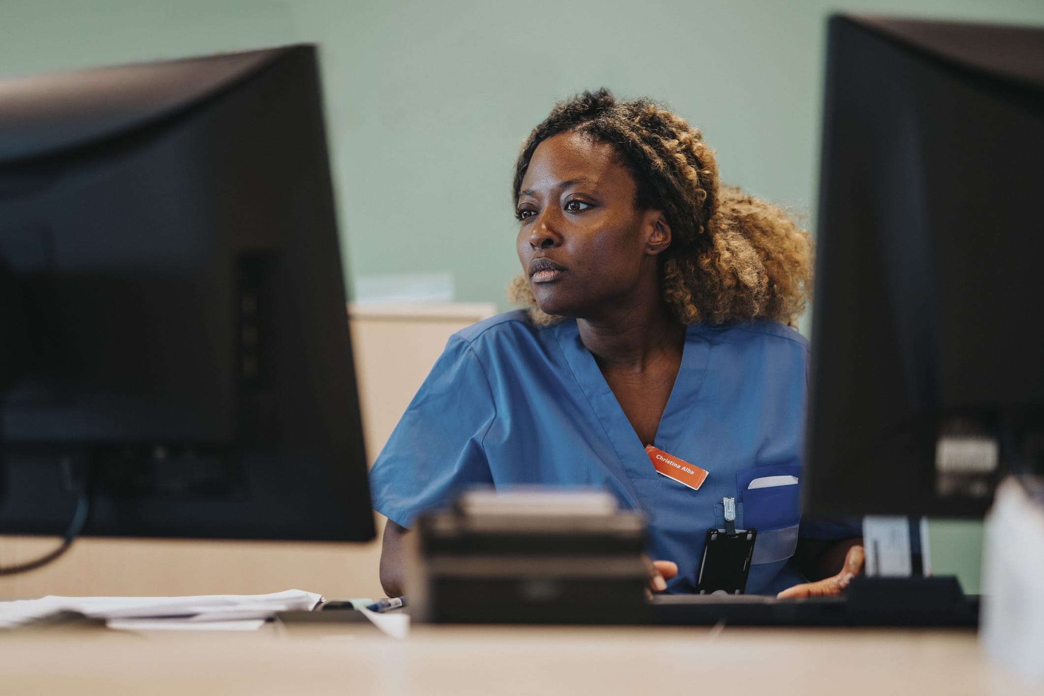 Healthcare provider sitting at computer