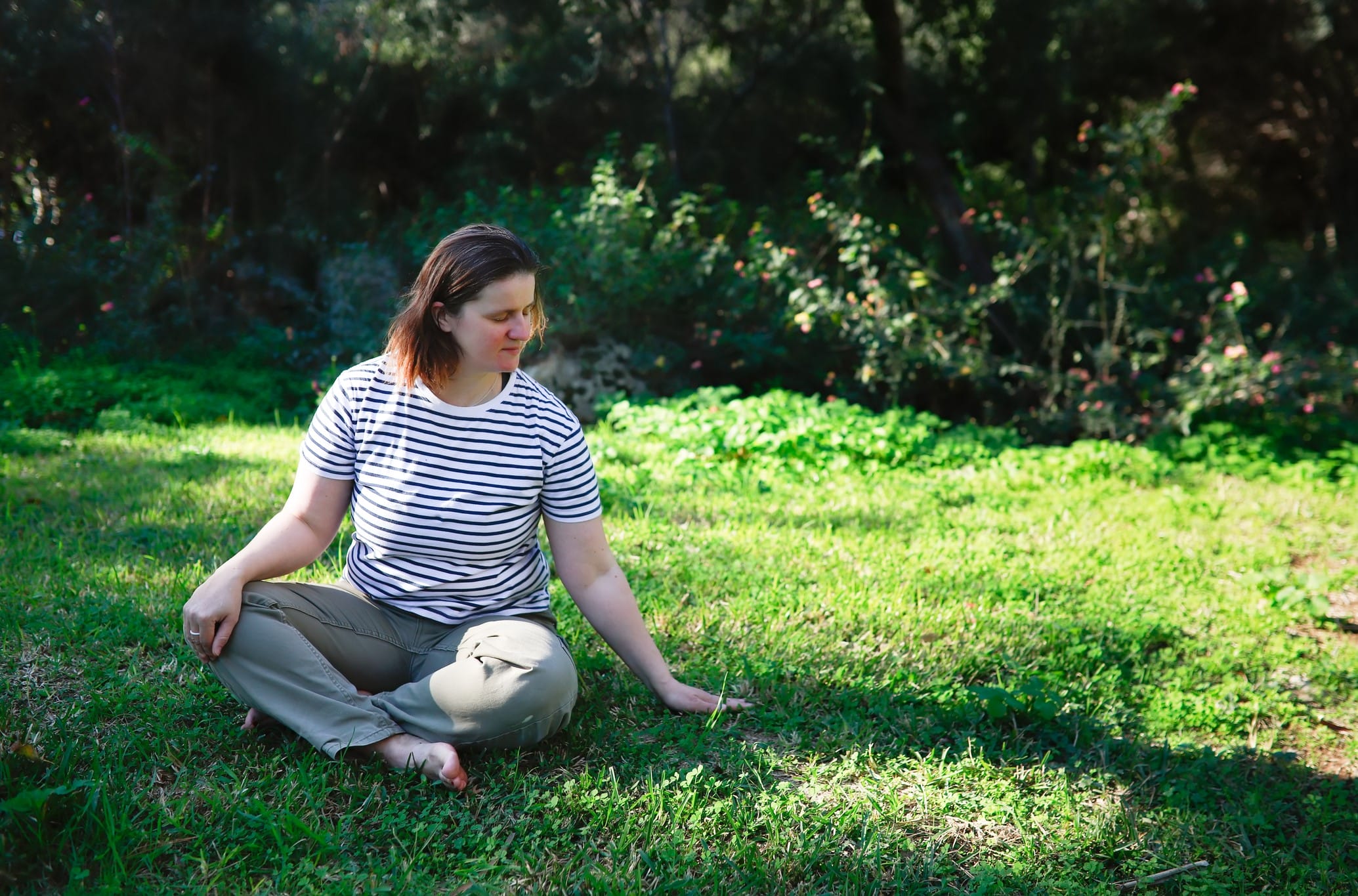 Woman sitting outside and meditating