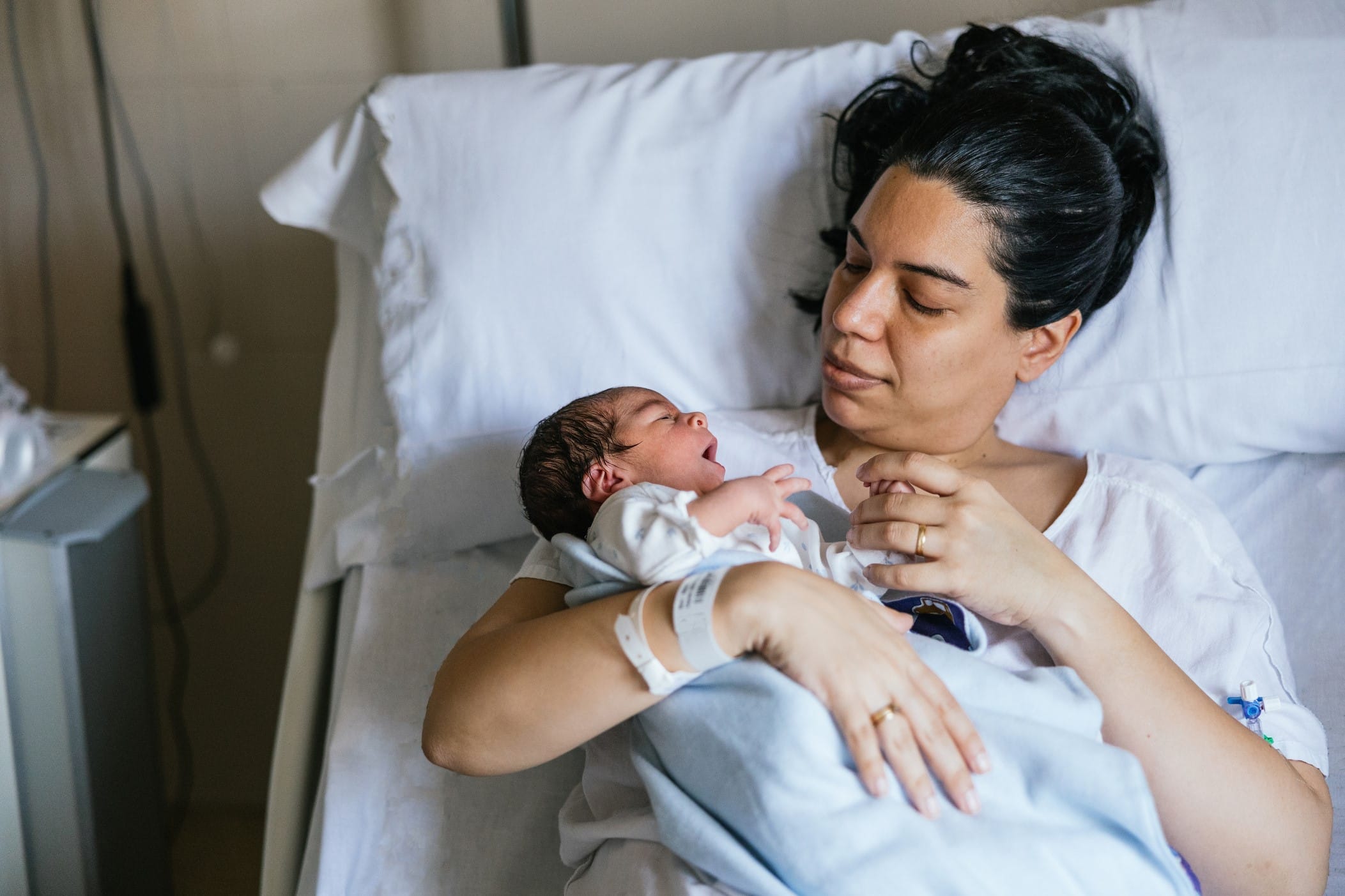 Mother and newborn infant in hospital bed