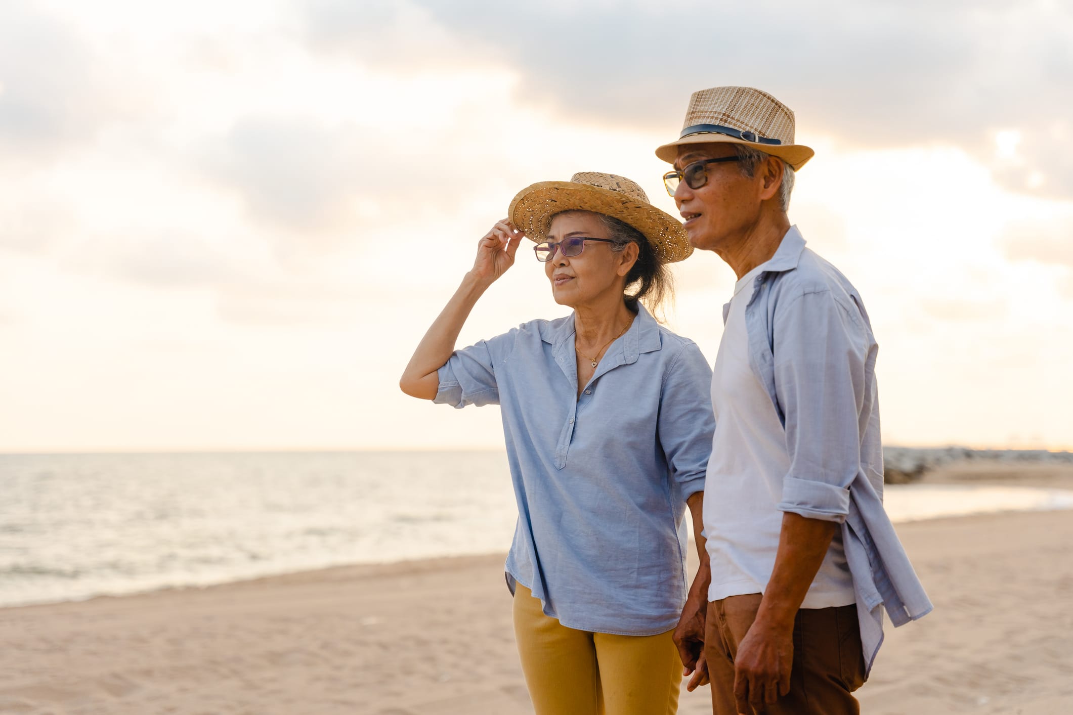 Senior couple walking on a beach