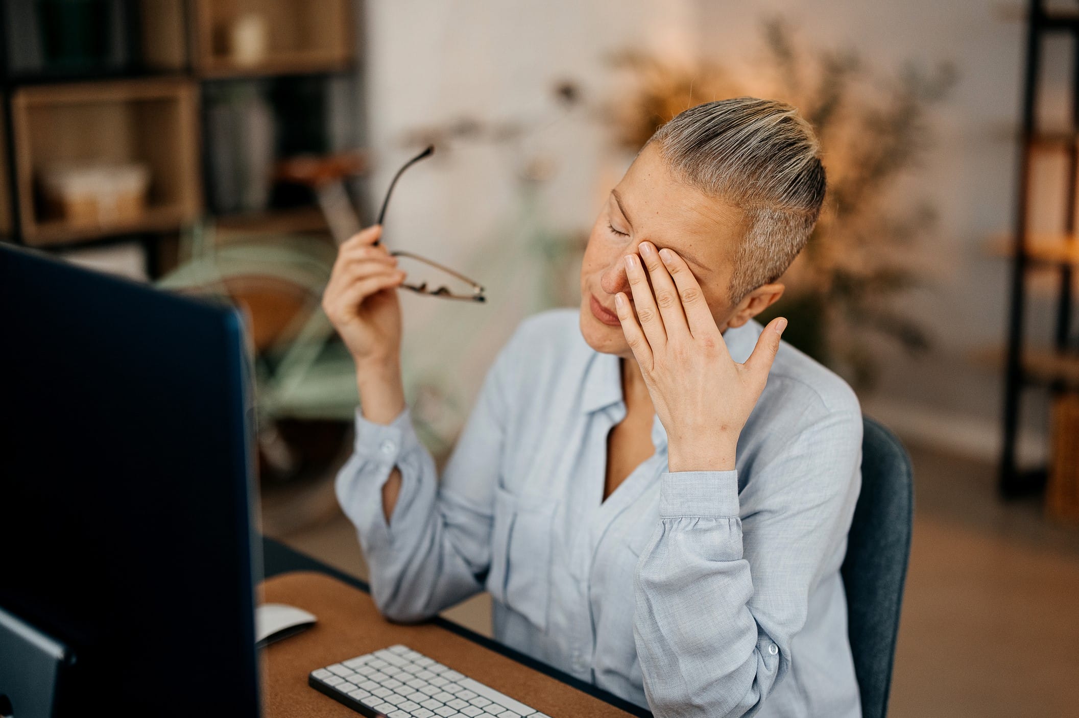 Woman rubbing her eyes