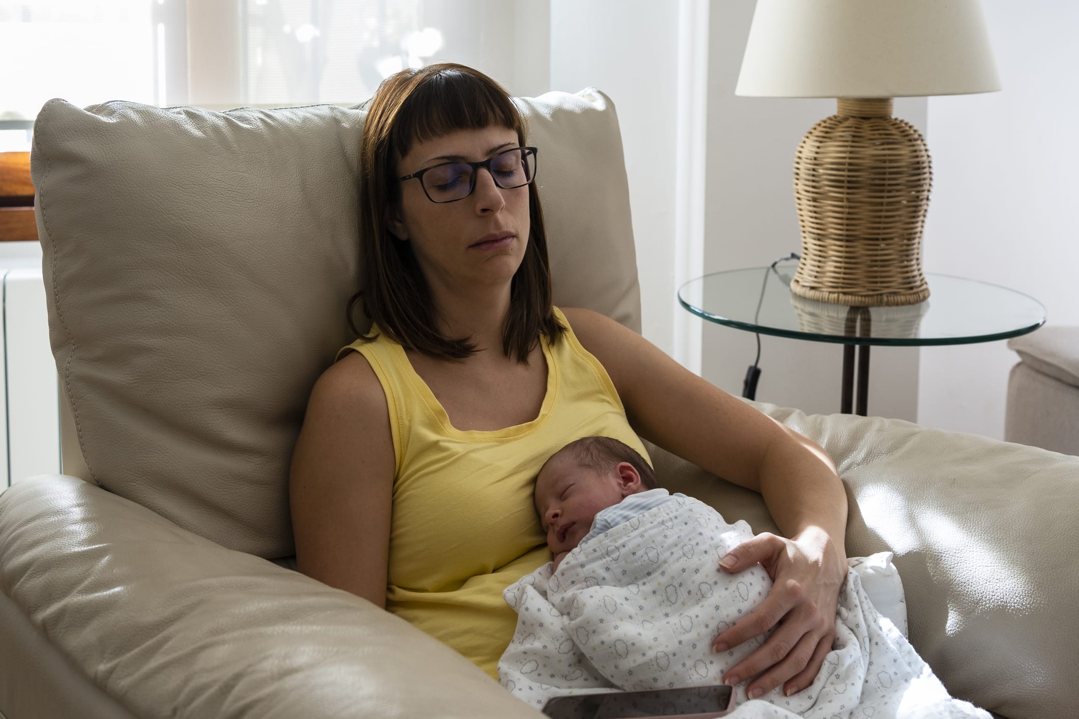 Baby sleeping on his mother